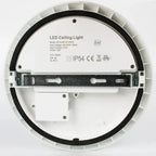 Rear view of round white LED ceiling light showing mounting bracket, wiring terminals, and specification label indicating 12W