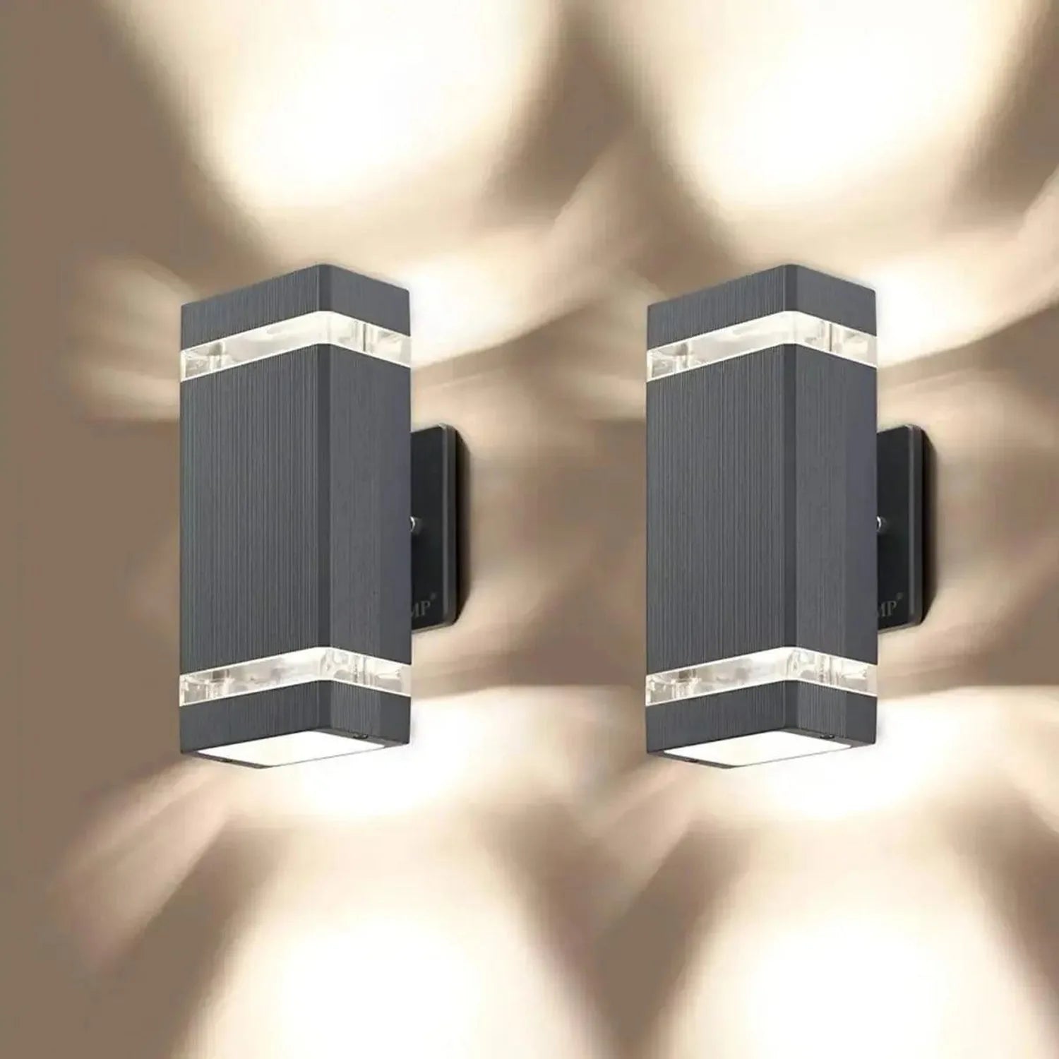 Two black rectangular LED wall sconces with horizontal light bands, mounted on a neutral background with atmospheric lighting