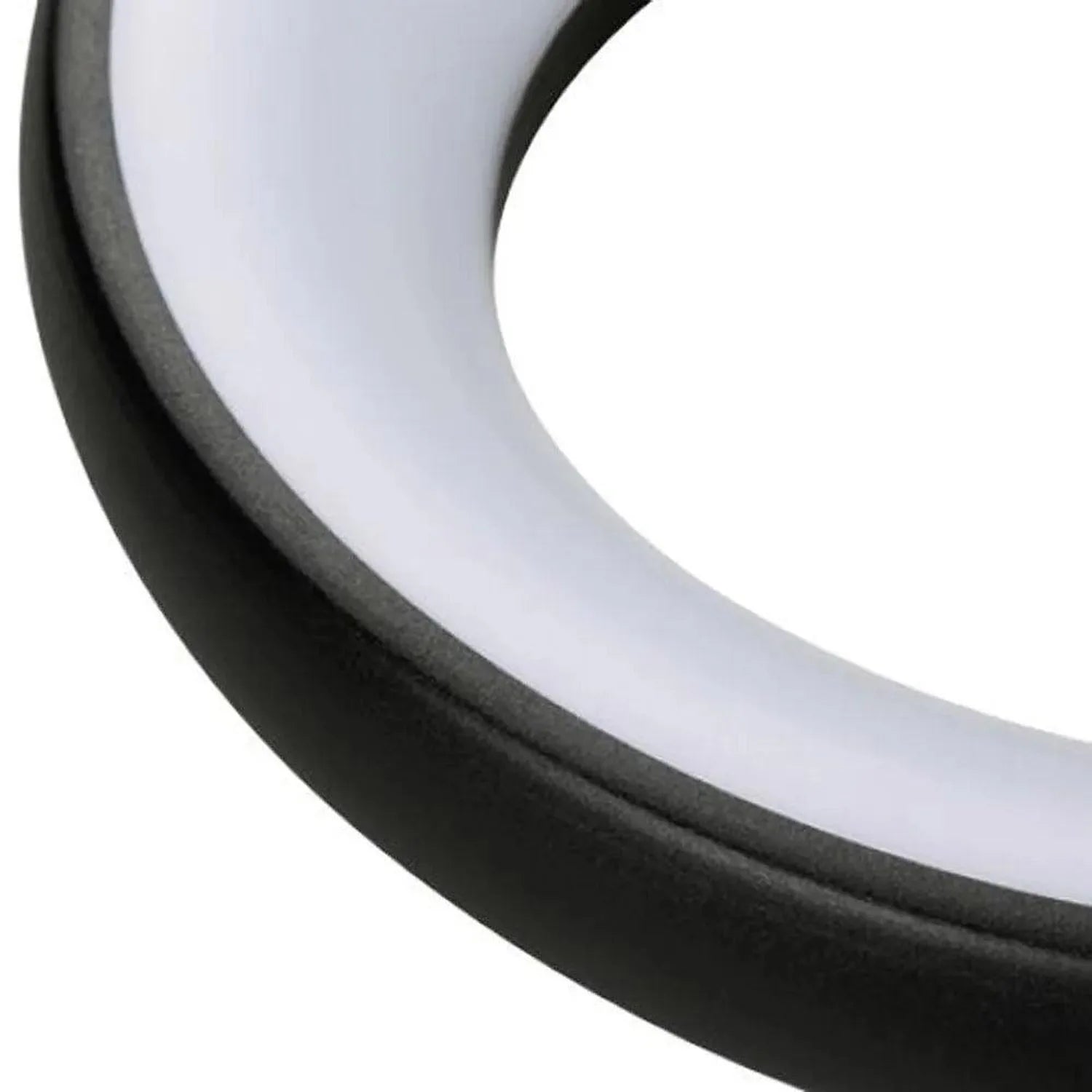 Close-up of curved white diffuser with black trim ring against white background.