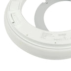 Bottom view of white circular LED ceiling light showing manufacturer label and mounting hardware details.