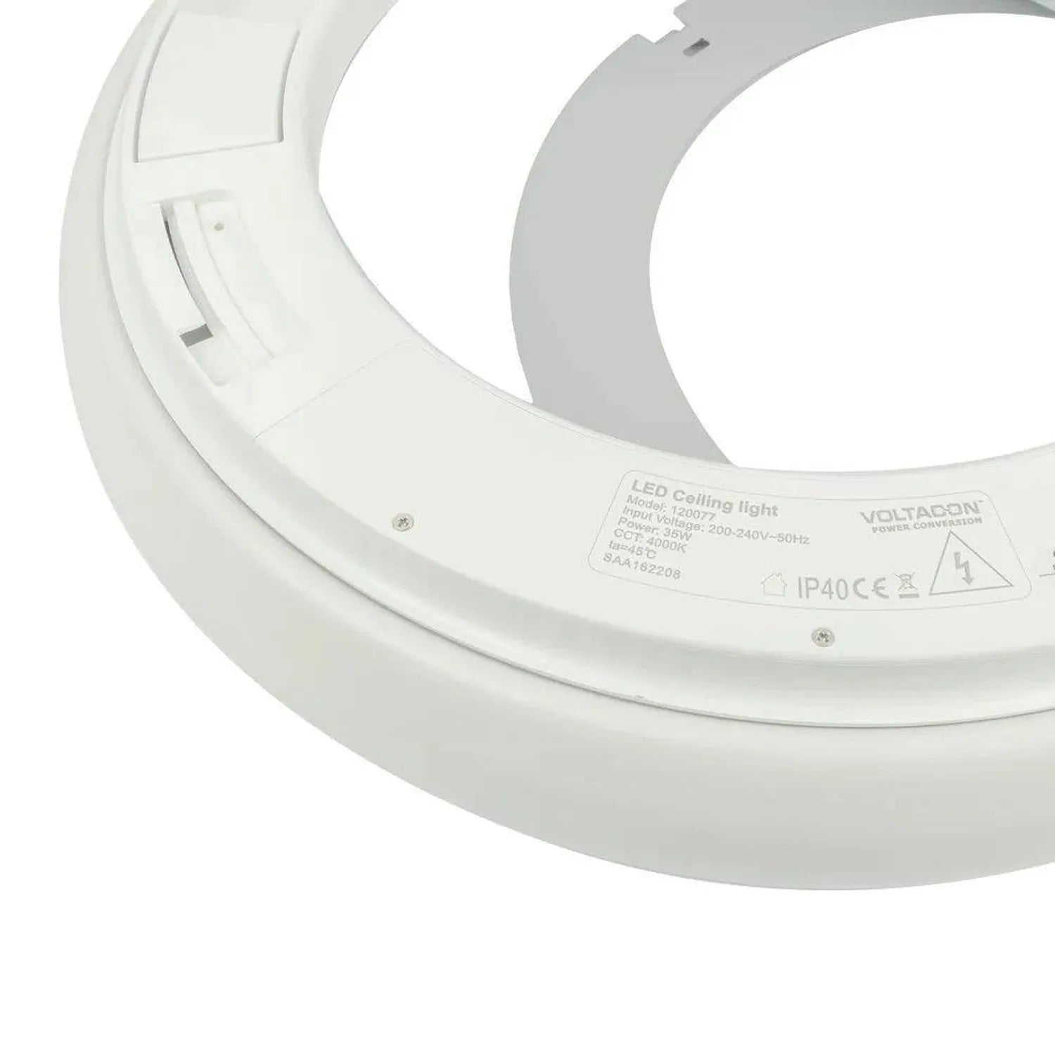 Bottom view of white circular LED ceiling light showing manufacturer label and mounting hardware details.