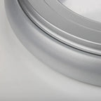 Close-up detail of sleek silver and grey circular LED ceiling light fixture with curved edge trim