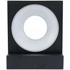 Black square wall lamp with frosted white circular diffuser and center opening, front view product shot.