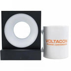 Etna LED wall lamp with circular frosted diffuser and black housing, displayed next to white mug branded Voltacon Power Conve