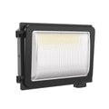 Black rectangular LED wall light with clear prismatic lens and mounting bracket, product shot on white background.