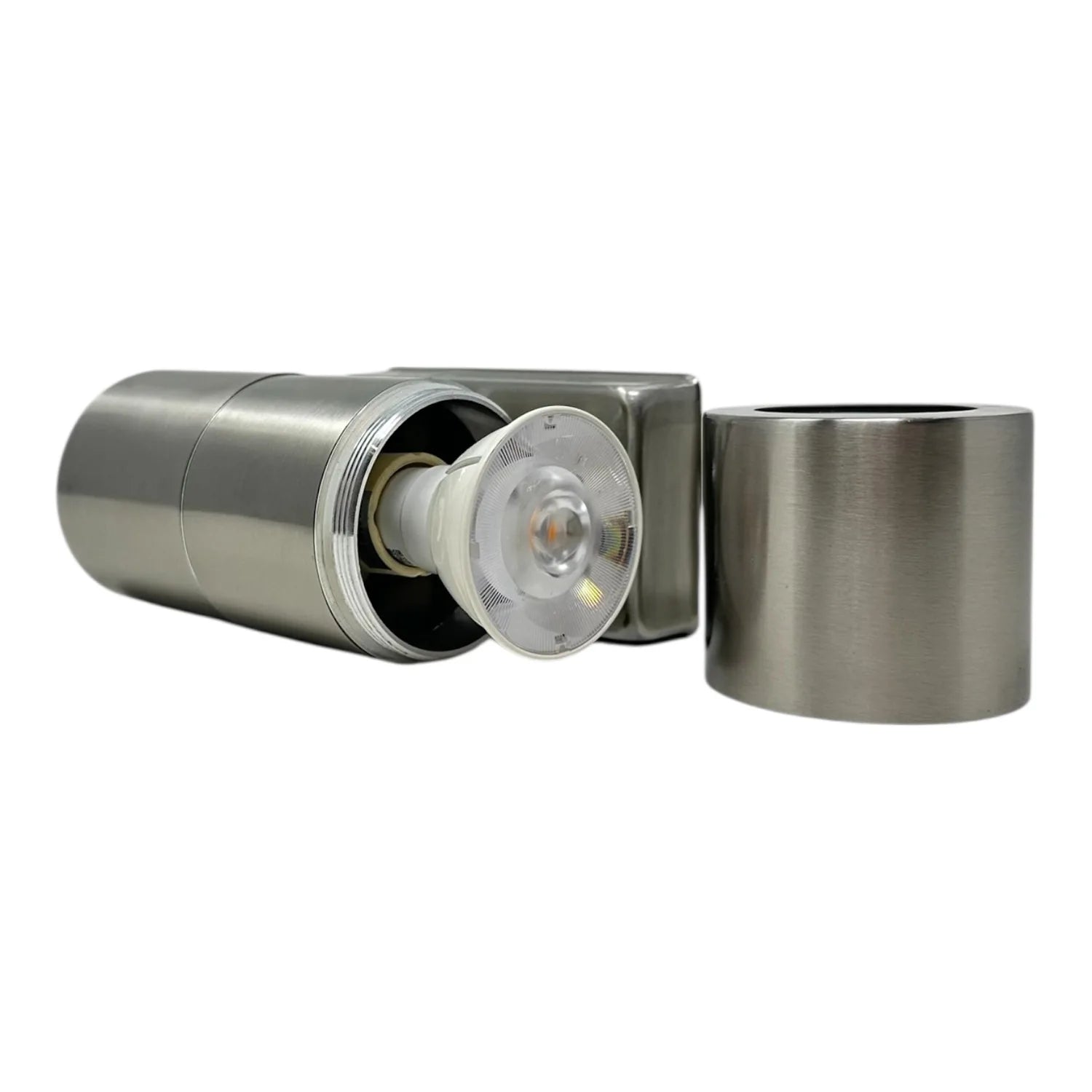 Stainless steel twin pack outdoor wall lights with cylindrical housings, one showing exposed LED module and reflector, displa