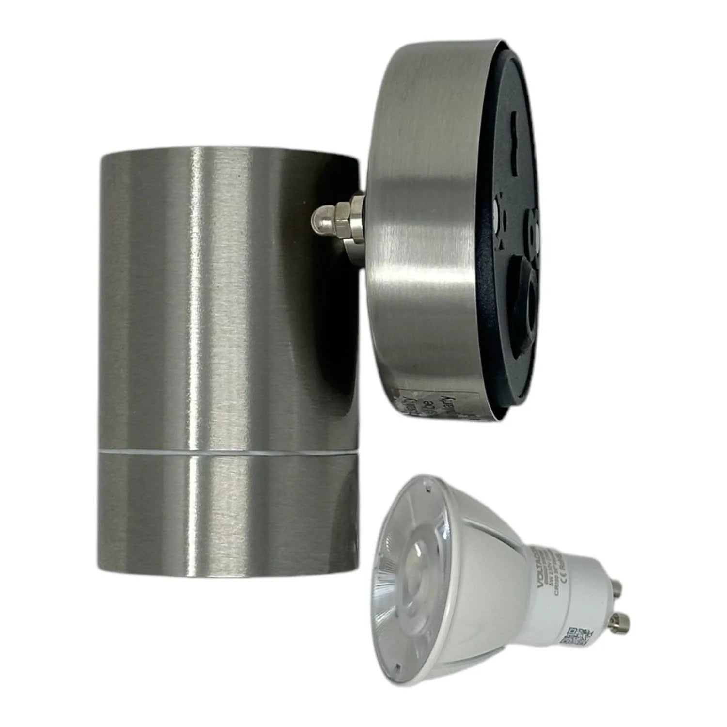 Disassembled LED outdoor downlight showing stainless steel cylindrical fixture body, black trim ring, and white GU10 LED bulb