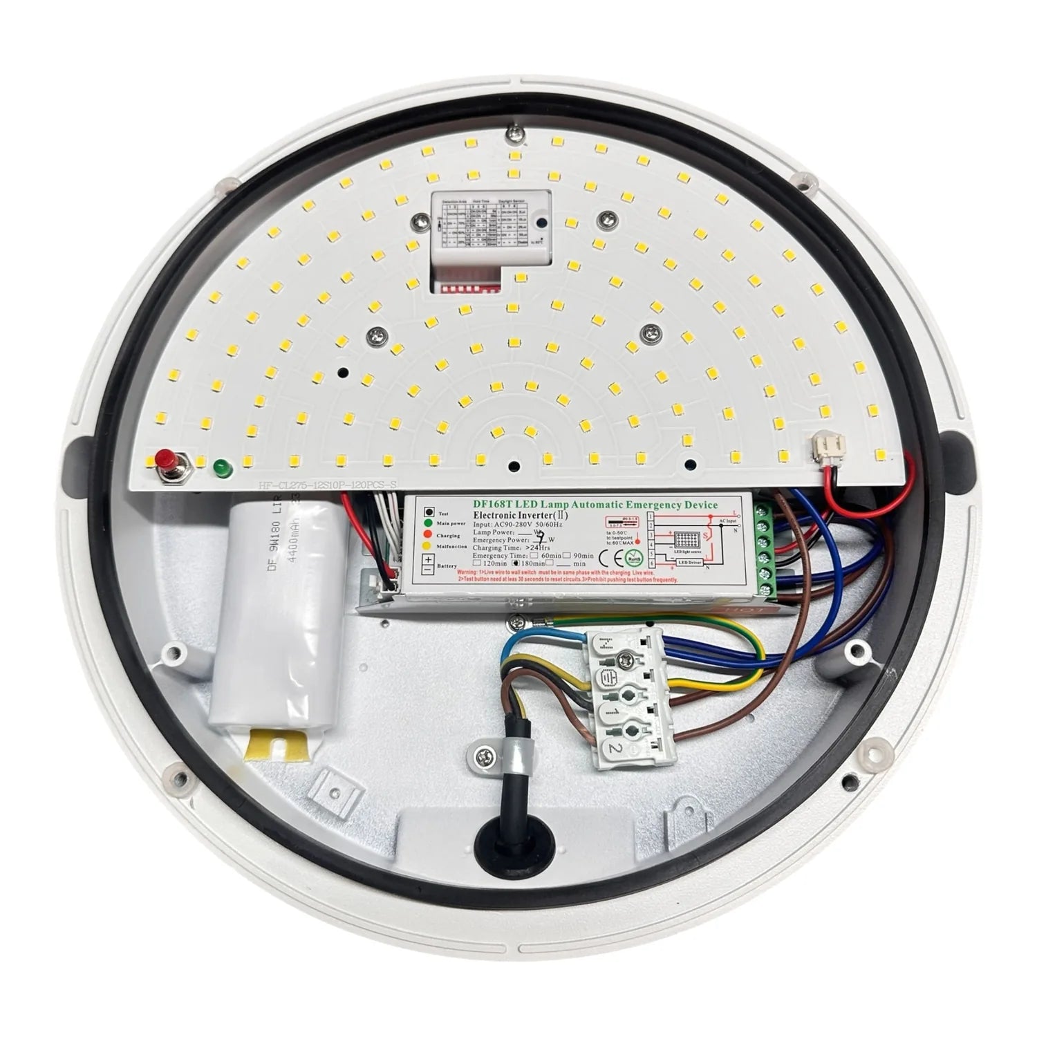 Interior view of round LED ceiling light showing circuit board with yellow LEDs, emergency inverter, wiring, and mounting com