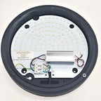 Voltacon LED eyelid wall light interior view showing circular PCB with dense LED array and white driver module with colored w