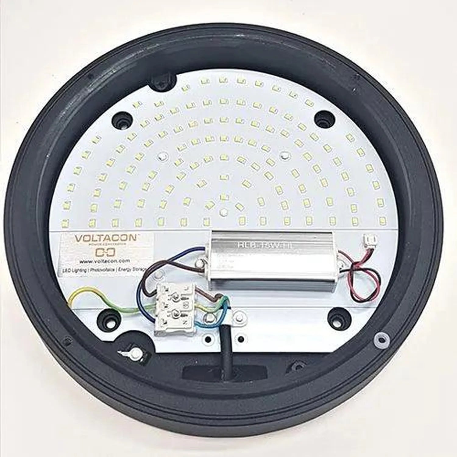 Voltacon LED eyelid wall light interior view showing circular PCB with dense LED array and white driver module with colored w