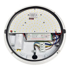 Interior view of round LED ceiling light showing circuit board with yellow LEDs, electronic inverter, wiring, and emergency b