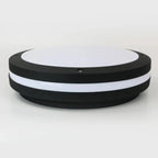 Round black and white LED wall light with integrated fixture shown against neutral background, product alone display.