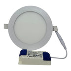 Round LED panel light with gray trim ring and white diffuser, mounted on white LED driver unit with blue accents and power ca