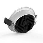 White LED recessed downlight with black ribbed heatsink and spring clips, shown as product alone against white background.
