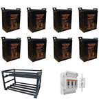Eight black Voltacon HXG6-300 gel batteries on steel rack with electrical enclosure and breaker panel components.