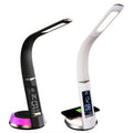 Two LED desk lamps with curved arms, digital clocks, and wireless charging bases in black and white finishes.