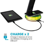OttLite LED desk lamp with integrated wireless charging pad and USB port, charging tablet and smartphone simultaneously.