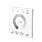 White square touch panel controller with central power button, group selection buttons top, and scene selection buttons botto