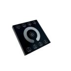 Black square touch panel controller with gray central dial and labeled scene buttons for all and scenes 1-3 arranged around t
