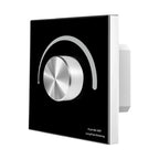 Black and white rotary dimmer switch with metallic dial and push on/off control against white background.