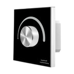 Black and white rotary dimmer switch with metallic silver knob and headphone icon graphic on faceplate.