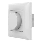 White rotary dimmer switch with large circular knob mounted on rectangular wall plate, product shot on white background.