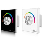 Two wall-mounted RGB LED dimmer controllers shown in black and white finishes, each featuring a metallic rotary knob surround