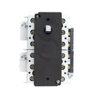 Overhead view of a black and white 3-pole DC isolator switch with brass terminal connectors and internal components visible f
