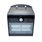 Black solar-powered wall light with motion sensor and four LED strips in lower panel, shown against white background.