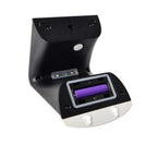 Black solar garden light with open battery compartment showing purple battery and LED indicator, white base visible.