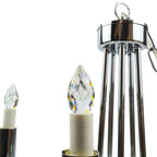 Three crystal LED candle bulbs with chrome and white fixtures, largest shown in tall cylindrical lantern with handle.