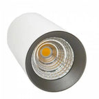 White cylindrical LED downlight with dark trim ring and warm amber LED visible, product alone on white background.