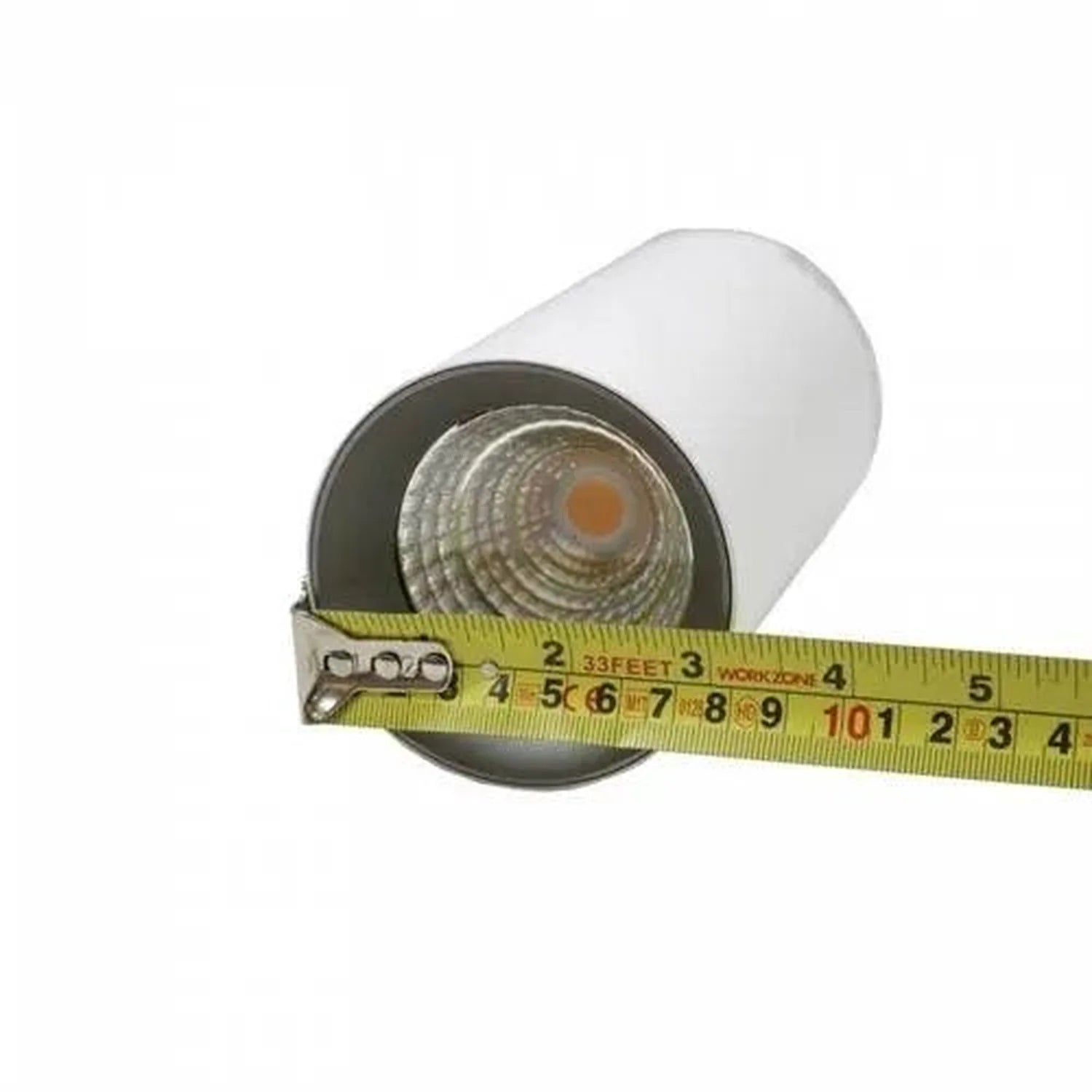 White cylindrical LED pendant downlight with warm light beam, measured against tape measure showing scale.