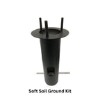 Black metal soft soil ground kit with cylindrical body, flange top, three threaded posts, and horizontal mounting bar.