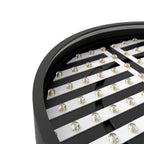 Close-up of circular ceiling light fixture showing white LED strips with amber light sources mounted on black curved housing.