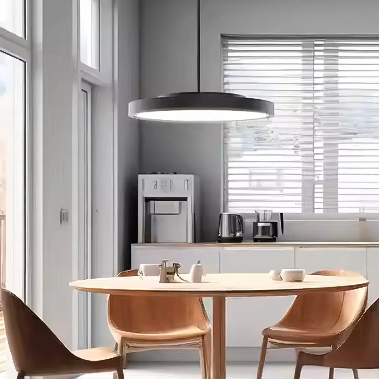 Modern kitchen with round pendant light suspended above dining table, showing installation in contemporary minimalist interio
