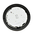 Overhead view of LED bulkhead light showing white circular PCB with yellow LED chips and black ring housing, internal compone