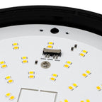 Close-up of LED circuit board showing yellow SMD chips, color temperature selector marked 3000K 4000K 5000K, and black trim r