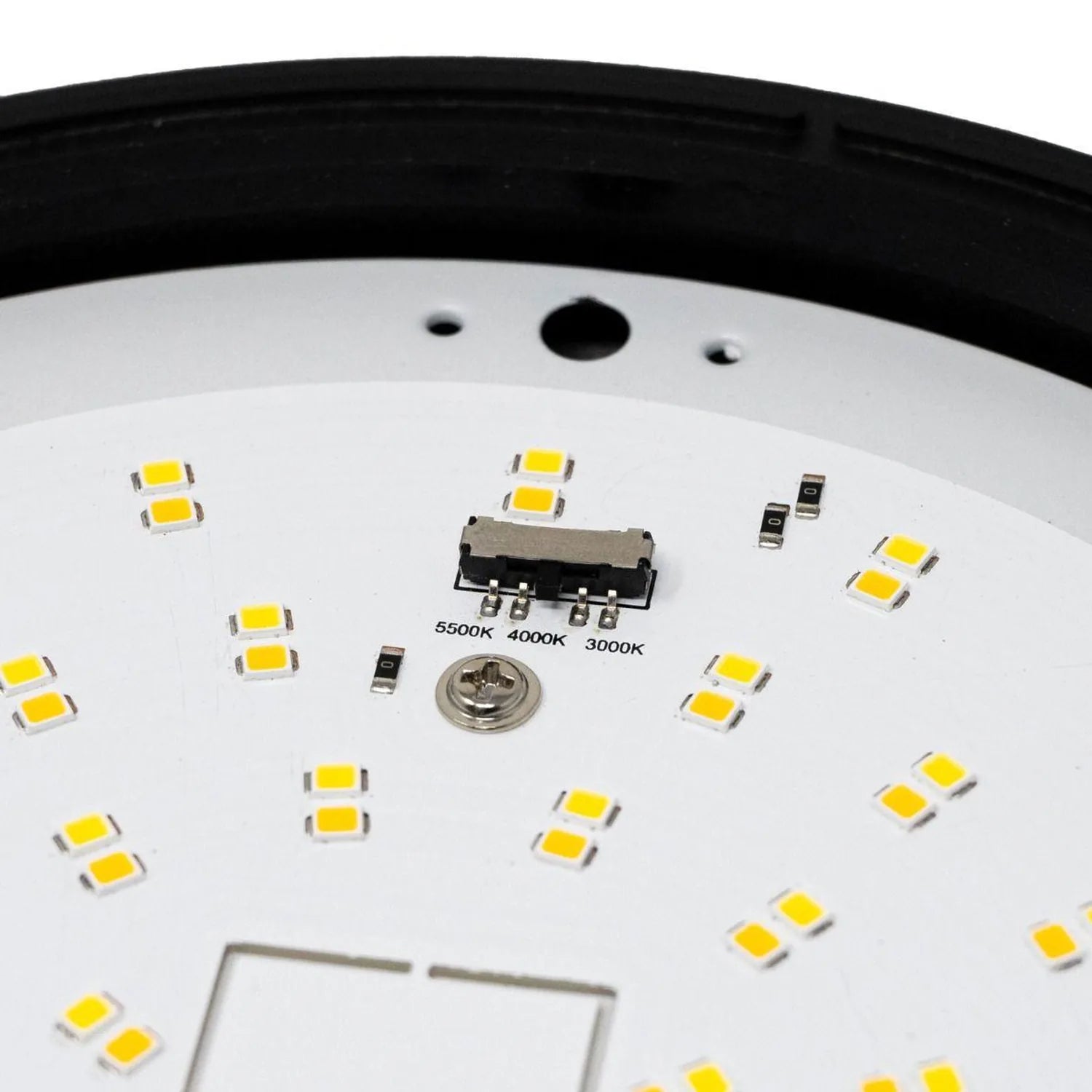 Close-up of LED circuit board showing yellow SMD chips, color temperature selector marked 3000K 4000K 5000K, and black trim r