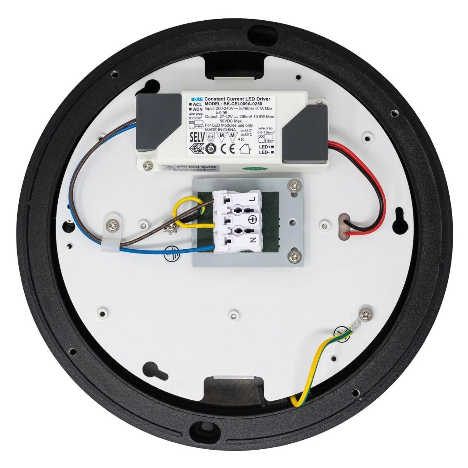 Interior view of LED bulkhead showing constant current driver, wiring, and terminal connections mounted on white backing plat
