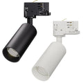 Two cylindrical LED track lights with visible lens front, one black and one white, mounted on track adapters with electrical 