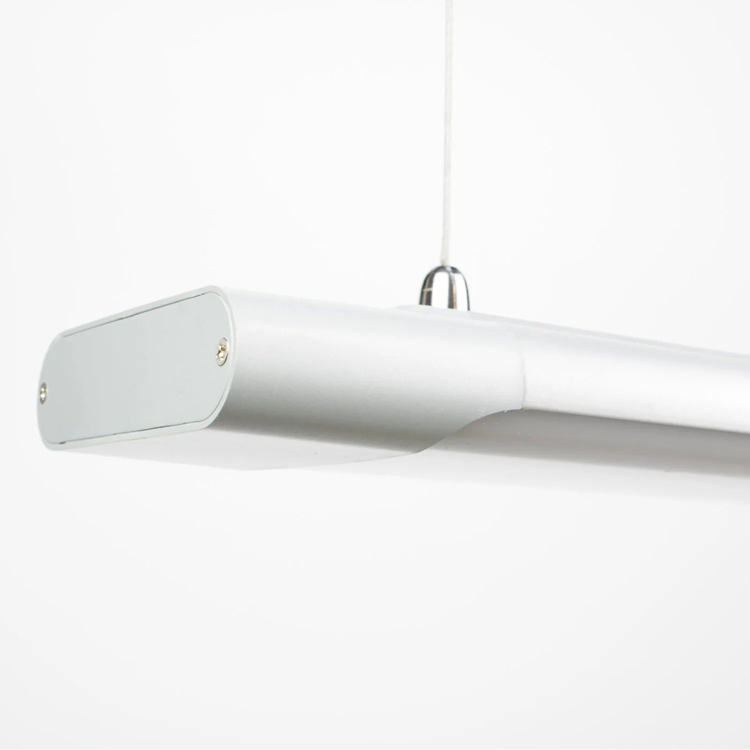 White cylindrical LED batten light suspended by cord, shown against plain background.