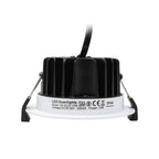LED recessed downlight showing bottom view with white trim ring, black heat sink fins, and specification label indicating 13W