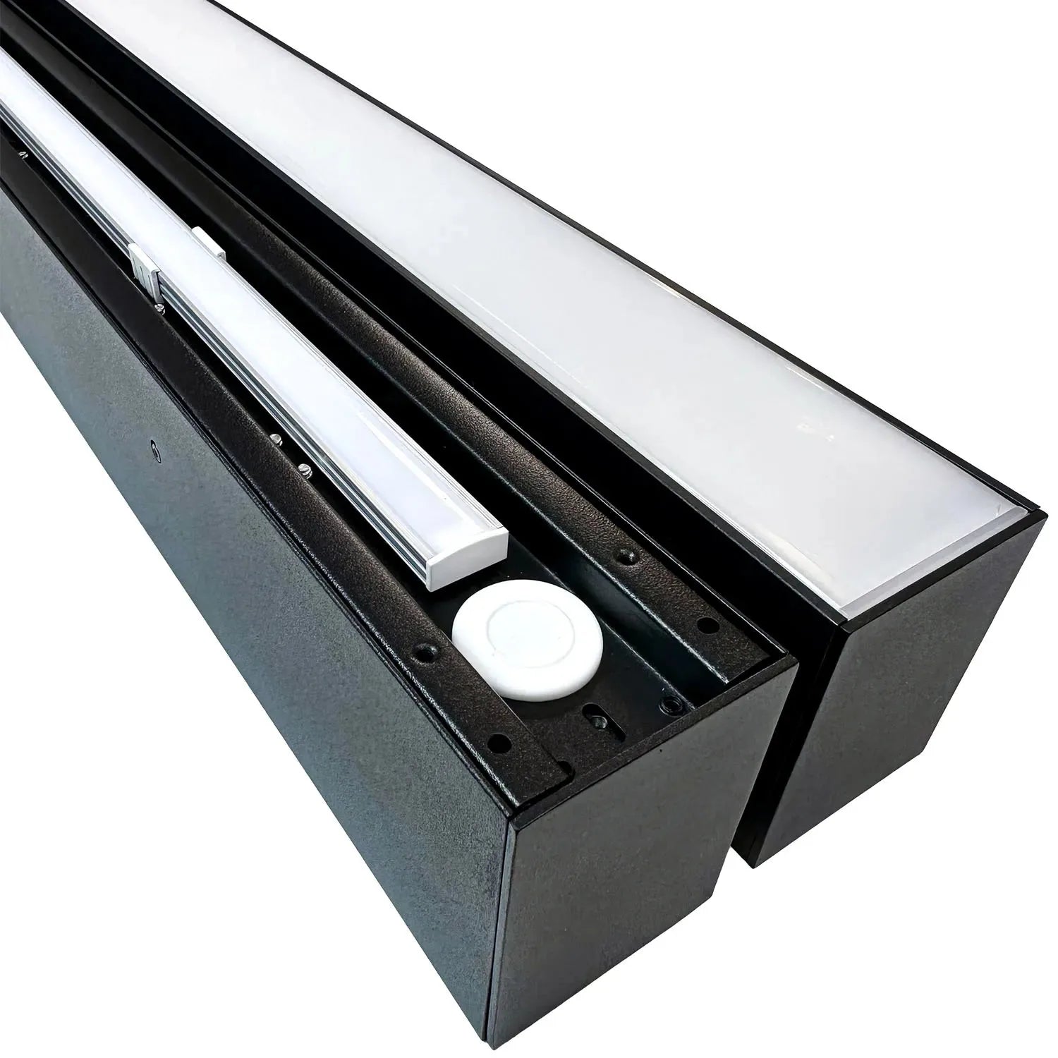 Two black wall-mounted LED light fixtures with frosted panels and motion sensor domes, displayed at an angle against white ba