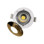 Fire rated LED downlight with gold bezel and white trim ring, shown with yellow LED visible in center and bezel separated bes