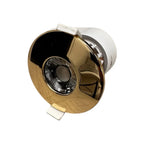 Gold bezel fire rated LED downlight with white trim ring and central lens, shown at angle against white background.