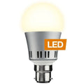 Silver and white LED bulb with B22 bayonet base, emitting warm light, labeled LED on orange badge.