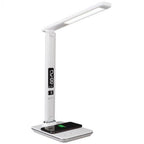 White LED desk lamp with integrated wireless phone charger, digital display, and adjustable arm on wide base.