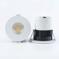 Front and side view of white recessed LED downlight with visible COB lens and separate white trim ring with black heat sink d