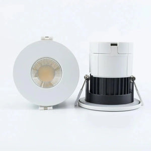 Front and side view of white recessed LED downlight with visible COB lens and separate white trim ring with black heat sink d